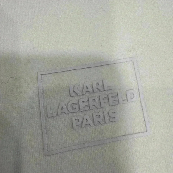 Karl Legerfeld Paris white 3/4 sleeve pullover with silver buttons and tie waist - Picture 11 of 11